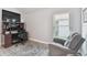Functional home office with a spacious desk, comfortable chair, and a bright window view at 30918 Burleigh Dr, Wesley Chapel, FL 33543