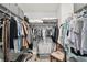 Organized walk-in closet featuring wire shelving, hanging rods, and ample storage space for clothes and personal items at 30918 Burleigh Dr, Wesley Chapel, FL 33543