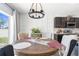 Comfortable dining area next to kitchen offers a pleasant space for meals with modern decor at 30936 Summer Sun Loop, Wesley Chapel, FL 33545