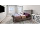 Comfortable bedroom with plush carpeting, elegant decor, and plenty of natural light from the windows at 30936 Summer Sun Loop, Wesley Chapel, FL 33545