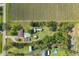 Aerial view of a home and land bordered by a red perimeter adjacent to planted farm land at 3217 Mott Rd, Dover, FL 33527