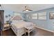 Bright bedroom with hardwood floors, large window, and comfortable furnishings at 3217 Mott Rd, Dover, FL 33527