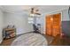 Bedroom with a ceiling fan, natural light, and closet space at 3217 Mott Rd, Dover, FL 33527