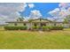 Charming single story home featuring well-manicured landscaping and a welcoming front porch at 3217 Mott Rd, Dover, FL 33527