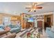 Comfortable living area that includes built-in shelving, a TV and an open kitchen area, perfect for gatherings at 3217 Mott Rd, Dover, FL 33527