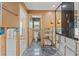 Bathroom featuring dark tile floors and double vanity with dark granite counters and unfinished walls at 3226 Gardenia Dr, Hernando Beach, FL 34607