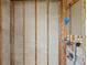Bathroom with exposed beams, plumbing, and a shower area ready for finishing touches at 3226 Gardenia Dr, Hernando Beach, FL 34607