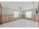 Bedroom featuring light blue walls, large windows and tile floor ready for renovation at 3226 Gardenia Dr, Hernando Beach, FL 34607