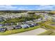 A lovely aerial view showcases a beautiful residential community with lakes and manicured landscaping at 33774 Castaway Loop, Wesley Chapel, FL 33543