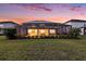 Expansive backyard view with a screened pool area, perfect for outdoor enjoyment and entertaining at 33774 Castaway Loop, Wesley Chapel, FL 33543