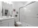 Bright bathroom featuring a glass shower, white vanity, and neutral-tone walls for a clean, modern look at 33774 Castaway Loop, Wesley Chapel, FL 33543