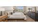 Comfortable bedroom showcasing lots of natural light with a view of lush landscaping at 33774 Castaway Loop, Wesley Chapel, FL 33543
