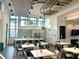 An interior view of the clubhouse with a kitchen and dining area at 33774 Castaway Loop, Wesley Chapel, FL 33543