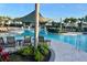 A shaded lounge area by the community pool at 33774 Castaway Loop, Wesley Chapel, FL 33543
