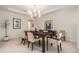 Dining room with elegant lighting and a spacious seating area at 33774 Castaway Loop, Wesley Chapel, FL 33543