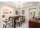 Dining room with modern decor and a view of the adjacent rooms at 33774 Castaway Loop, Wesley Chapel, FL 33543
