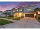 Stunning two-story home with a well-manicured lawn and an attached two-car garage at 33774 Castaway Loop, Wesley Chapel, FL 33543