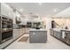 Well-equipped kitchen features stainless steel appliances and a center island at 33774 Castaway Loop, Wesley Chapel, FL 33543