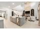 Open kitchen features stainless steel appliances and a view of the living room at 33774 Castaway Loop, Wesley Chapel, FL 33543