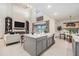 Open-concept kitchen with modern finishes, an island with seating, and views of the adjacent living area and backyard at 33774 Castaway Loop, Wesley Chapel, FL 33543