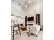 Bright living room features a fireplace, built-in shelves, and soaring ceilings at 33774 Castaway Loop, Wesley Chapel, FL 33543