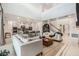 Bright and airy living room that leads to kitchen, features high ceilings and an open floor plan, great for entertaining at 33774 Castaway Loop, Wesley Chapel, FL 33543