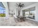 Beautiful outdoor space showcasing a large dining table and views of the golf course at 33774 Castaway Loop, Wesley Chapel, FL 33543