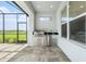 Covered patio features a built-in outdoor kitchen with stainless steel appliances and beautiful views at 33774 Castaway Loop, Wesley Chapel, FL 33543