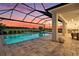 Beautiful pool featuring a waterfall and an integrated spa at 33774 Castaway Loop, Wesley Chapel, FL 33543