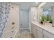 Bathroom showcasing a tub-shower combination, dual sink vanity, and contemporary finishes at 3420 Timber Crossing Ave, Brandon, FL 33511