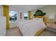 Vibrant bedroom featuring bright colors, large windows, and unique decor at 3420 Timber Crossing Ave, Brandon, FL 33511