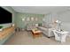 Comfortable living area with a sectional sofa, TV, and stylish decor at 3420 Timber Crossing Ave, Brandon, FL 33511