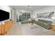 Spacious living room with sliding glass doors, neutral decor, and modern furnishings at 3424 Timber Crossing Ave, Brandon, FL 33511