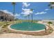 Enclosed backyard space with manicured landscaping and water view at 3595 41St S Ln # L, St Petersburg, FL 33711