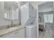 Bathroom featuring stackable washer/dryer and granite countertops at 3595 41St S Ln # L, St Petersburg, FL 33711