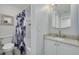 Bathroom featuring a white vanity, toilet and shower/tub combo at 3595 41St S Ln # L, St Petersburg, FL 33711