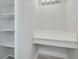 Walk-in closet with shelving, vanity, and ample storage space at 3595 41St S Ln # L, St Petersburg, FL 33711