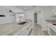 Kitchen area with granite countertops, stainless steel appliances, and view of living area at 3595 41St S Ln # L, St Petersburg, FL 33711