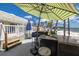 Outdoor bar area with granite countertop and covered patio umbrella at 3595 41St S Ln # L, St Petersburg, FL 33711