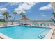 Community pool with ample lounge seating and ocean view at 3595 41St S Ln # L, St Petersburg, FL 33711