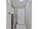 Efficient laundry room featuring a modern washer and dryer, complemented by white cabinets for storage at 3634 Springville Dr, Valrico, FL 33596