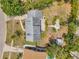 Aerial view of the property with a shed, landscaping, and mature trees at 3865 Gatewood Dr, Sarasota, FL 34232