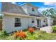 Exterior with beautiful landscaping, patio, and mature plants at 3865 Gatewood Dr, Sarasota, FL 34232