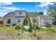 View of backyard with patio, garden, and exterior door with small step at 3865 Gatewood Dr, Sarasota, FL 34232