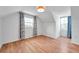 Attic bedroom with hardwood floors, vaulted ceilings, and natural light at 3865 Gatewood Dr, Sarasota, FL 34232