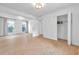 Bright bedroom featuring wood-look tile floors, closet, and natural light at 3865 Gatewood Dr, Sarasota, FL 34232