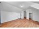 Bedroom featuring hardwood floors, white walls, closet and neutral lighting at 3865 Gatewood Dr, Sarasota, FL 34232