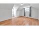Bright bedroom with hardwood floors, two windows, and neutral paint at 3865 Gatewood Dr, Sarasota, FL 34232