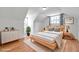 Minimalist bedroom with wood floors and a neutral color scheme at 3865 Gatewood Dr, Sarasota, FL 34232