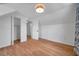 Bright bedroom featuring hardwood floors, fresh paint, and plenty of closet space at 3865 Gatewood Dr, Sarasota, FL 34232